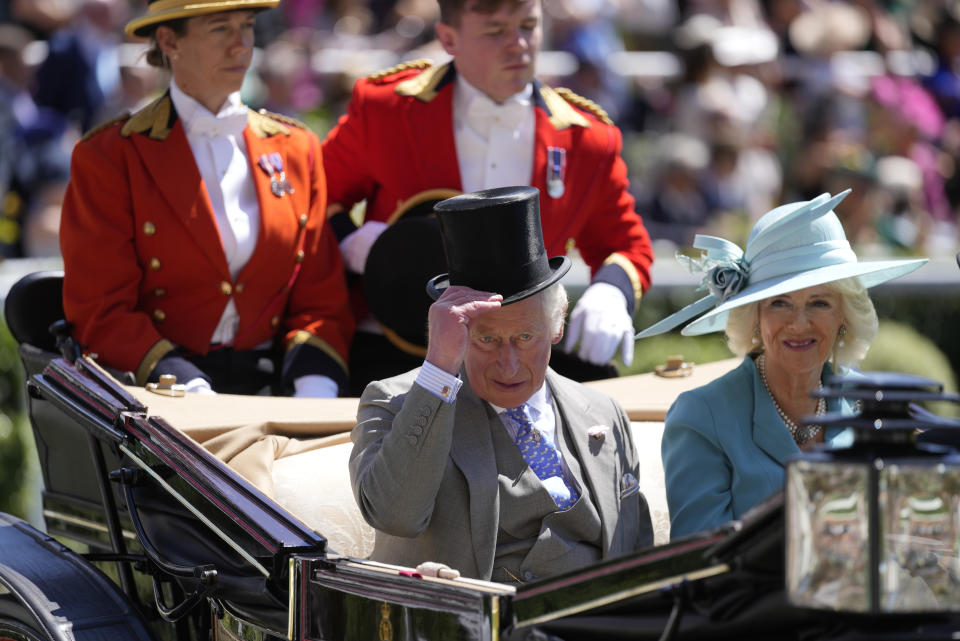 Britain's Prince Charles and Camilla, Duchess of Cornwall arrive by carriage for day one of the Royal Ascot horse racing meeting, at Ascot Racecourse, in Ascot, England, Tuesday June 14, 2022. (AP Photo/Alastair Grant)