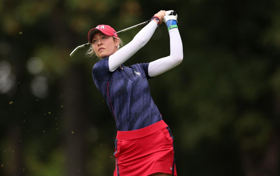 Nelly Korda of Team United States plays her second shot on the first hole during the Friday Fourball matches against Team Europe during the first round of the Solheim Cup 2024 at Robert Trent Jones Golf Club