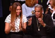 <p>Watching Jay-Z's beloved Brooklyn Nets at the Barclays Centre in 2014.</p>