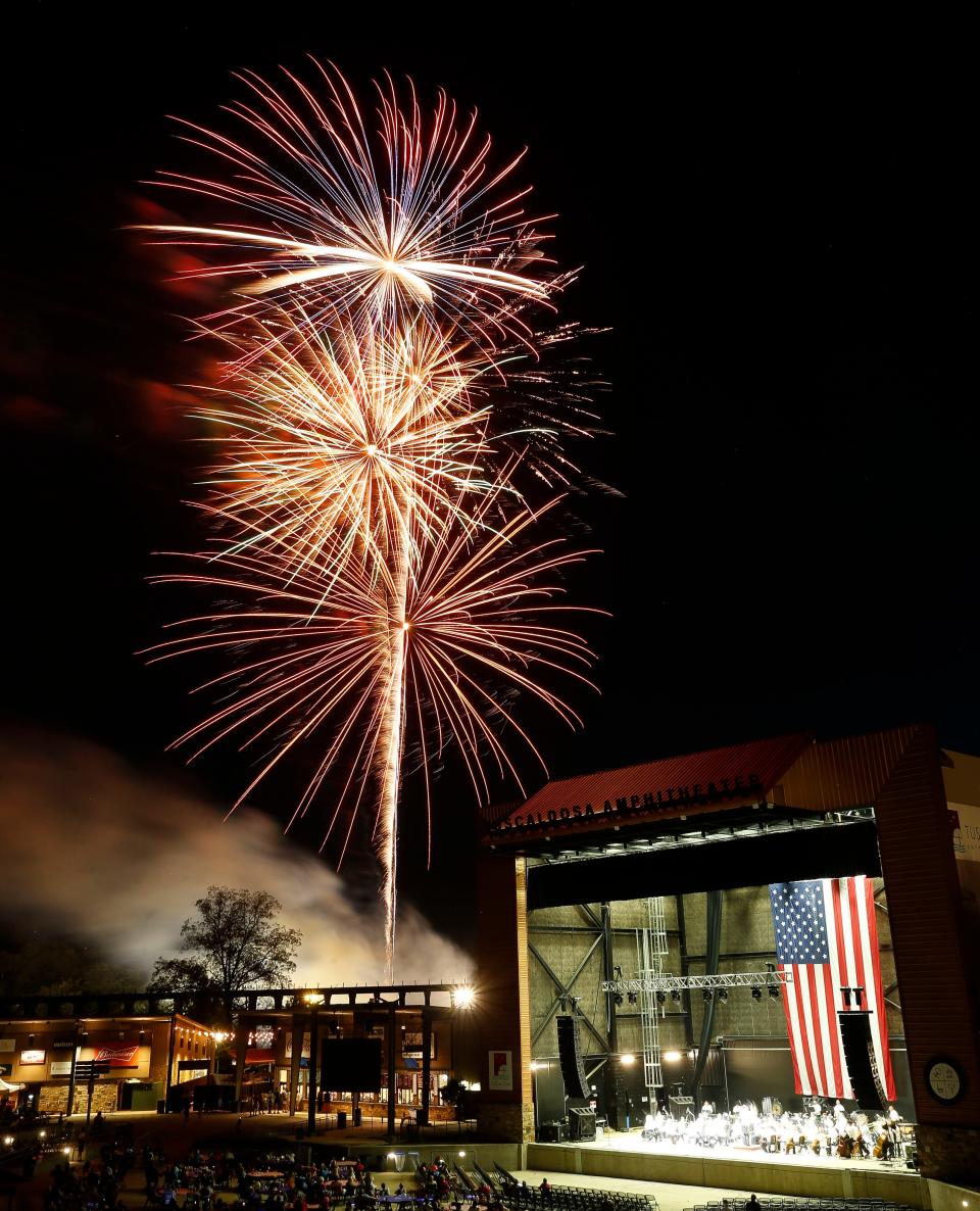 Fourth of July celebrants enjoy the fireworks show from inside the Tuscaloosa Amphitheater Thursday, July 4, 2019. [Staff Photo/Gary Cosby Jr.]