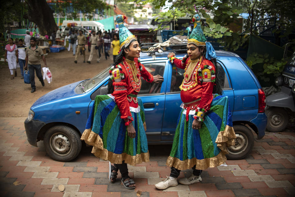 Folk artists wait to participate in a procession marking 'Atham', the first day of the ten-day-long Onam festival in Kochi, Kerala state, India, Sunday, Aug.20, 2023. (AP Photo/R S Iyer)