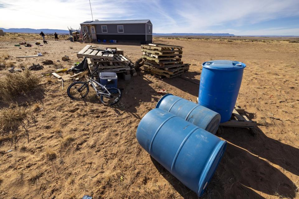 Water barrels lie empty at Gilarya Begaye's Navajo Nation home after a new water system was installed