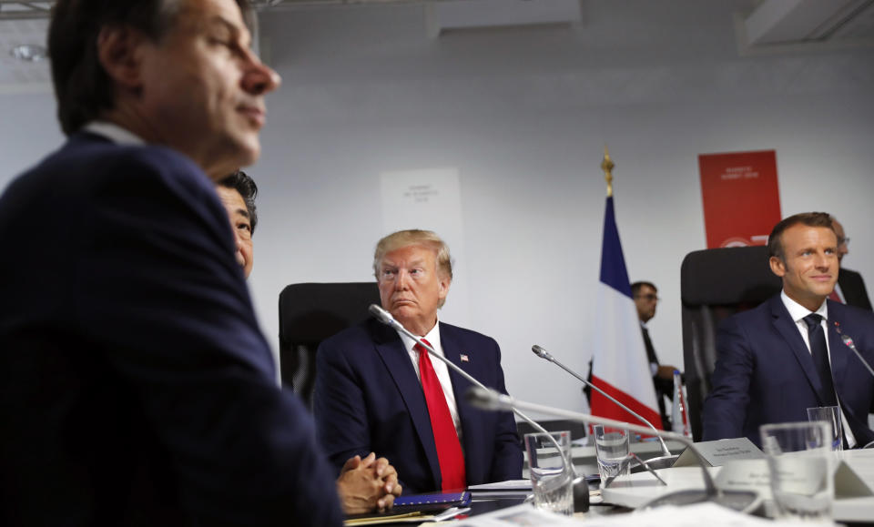 Italy's Prime Minister Giuseppe Conte, Japanese Prime Minister Shinzo Abe, President Donald Trump and French President Emmanuel Macron, from bottom left, attend a working session during the third and final day of the G-7 summit in Biarritz, France, Monday Aug. 26, 2019. (Carlos Barria, Pool via AP)