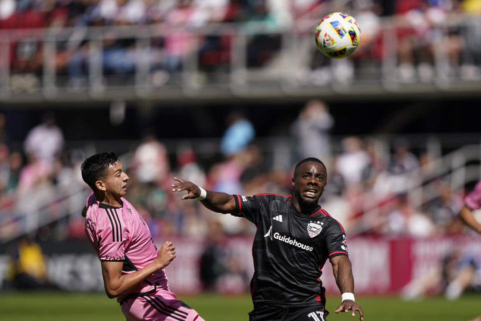DC United right winger Cristian Dajome, right, competes for the ball with Inter Miami center back Tomas Aviles during the first half of an MLS soccer match at Audi Field, Saturday, March 16, 2024, in Washington. (AP Photo/Nathan Howard)