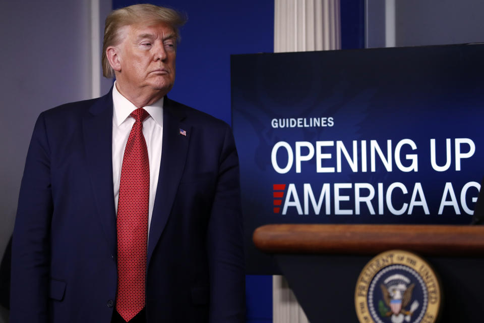 President Donald Trump listens during a briefing about the coronavirus in the James Brady Press Briefing Room of the White House, Thursday, April 16, 2020, in Washington. (AP Photo/Alex Brandon)