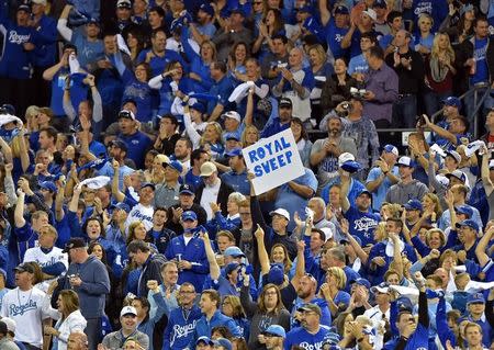 Oct 5, 2014; Kansas City, MO, USA; Kansas City Royals fans hold up a sign against the Los Angeles Angels during game three of the 2014 ALDS baseball playoff game at Kauffman Stadium. Mandatory Credit: Peter G. Aiken-USA TODAY Sports