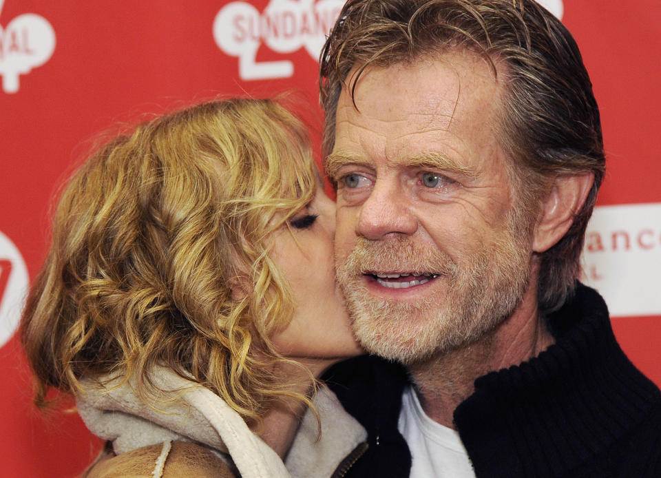 William H. Macy, right, writer/director/cast member of "Ruddlerless," gets a kiss from his wife, cast member Felicity Huffman, at the premiere of the film at the 2014 Sundance Film Festival, on Friday, Jan. 24, 2014, in Park City, Utah. (Photo by Chris Pizzello/Invision/AP)