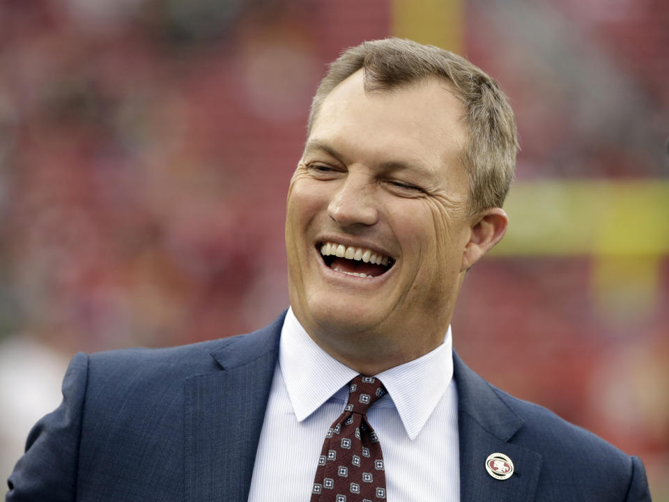 FILE - In this Jan. 19, 2020, file photo, San Francisco 49ers general manager John Lynch laughs before the team's NFC championship NFL football game against the Green Bay Packers in Santa Clara, Calif. Lynch was hired along with coach Kyle Shanahan to rebuild the San 49ers in 2017. Lynch was named executive of the year by the Pro Football Writers of America in his third season when he helped the Niners reach the Super Bowl and has the franchise in position to contend again this season. His ability to thrive in everything he does led Shanahan to nickname him “Captain America.” (AP Photo/Marcio Jose Sanchez, File)