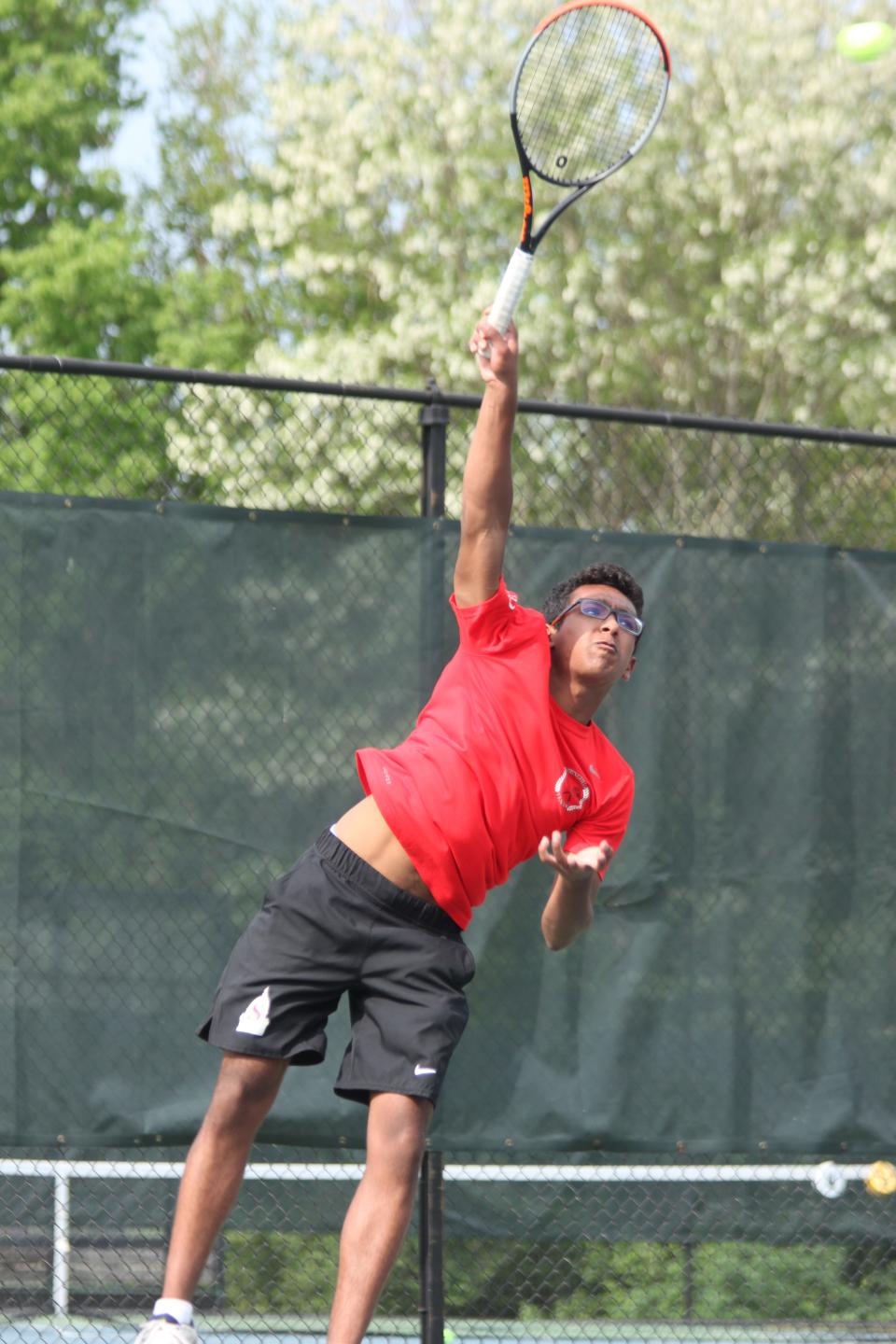 Springfield High's Krish Khurana serves the ball during the Central State Eight Conference boys tennis tournament at Washington Park on Friday, May 13.