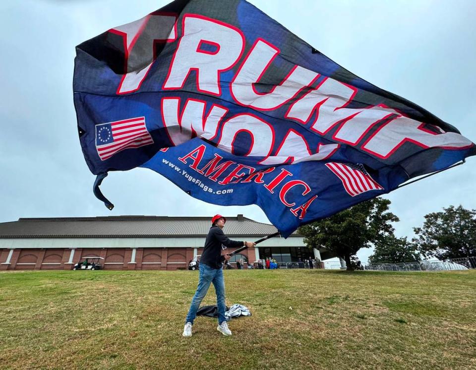 Owen Burke of Fort Mill greets people outside Winthrop Coliseum ahead of former President Donald Trump scheduled to arrive on Friday, Feb. 23, 2024 .