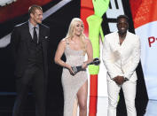 Rob Gronkowski, from left, Lindsey Vonn, and Dwyane Wade accept their awards for best moment at the ESPY Awards on Wednesday, July 10, 2019, at the Microsoft Theater in Los Angeles. (Photo by Chris Pizzello/Invision/AP)