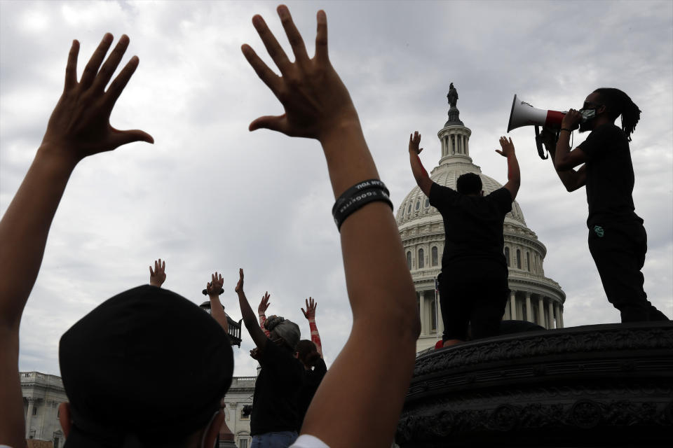 Demonstrators protest the death of George Floyd as they gather Wednesday, June 3, 2020, on the East side of the U.S. Capitol in Washington. Floyd died after being restrained by Minneapolis police officers. (AP Photo/Jacquelyn Martin)