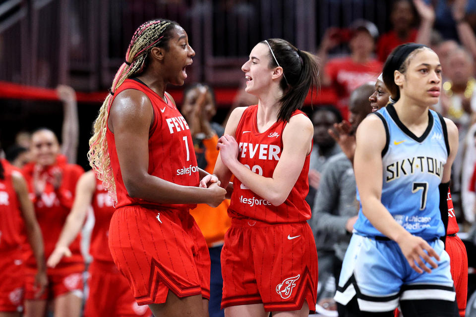 INDIANAPOLIS, INDIANA – JUNE 01: Aliyah Boston #7 and Caitlin Clark #22 of the Indiana Fever celebrate after beating the Chicago Sky in the game at Gainbridge Fieldhouse on June 1, 2024 in Indianapolis, Indiana.  NOTE TO USER: User expressly acknowledges and agrees that by downloading and/or using this photo, user agrees to the terms and conditions of the Getty Images License Agreement.  (Photo by Andy Lyons/Getty Images)