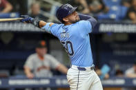 Tampa Bay Rays' Rene Pinto follows through on a home run against the San Francisco Giants during the sixth inning of a baseball game Sunday, April 14, 2024, in St. Petersburg, Fla. It was Pinto's second home run of the game. (AP Photo/Mike Carlson)