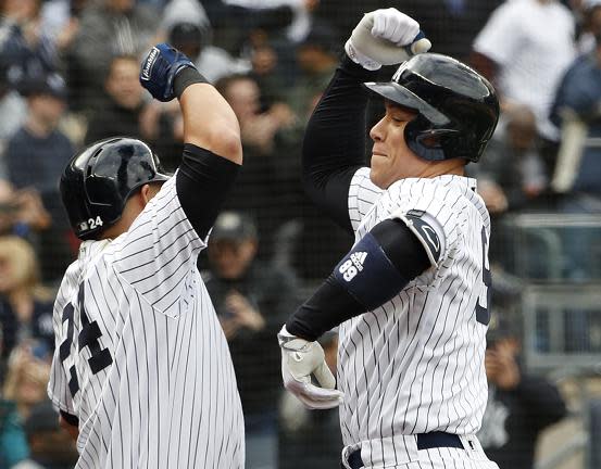 Gary Sanchez (left) and Aaron Judge celebrate Judge’s first homer of 2018. Together with Giancarlo Stanton, the Yankees power trio homered in the same game for the first time in a 7-2 win against the Rays. (AP)