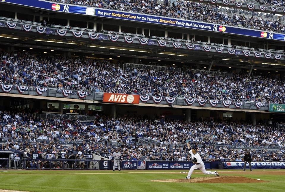 FILE - In this Oct. 14, 2012, file photo, New York Yankees' Hiroki Kuroda throws in the sixth inning of Game 2 of the American League championship series against the Detroit Tigers at Yankee Stadium in New York. Secondary ticket websites are drawing increased attention from sports teams concerned about the effect of the low-price seats on their ability to sell their remaining inventory. (AP Photo/Paul Sancya , File)