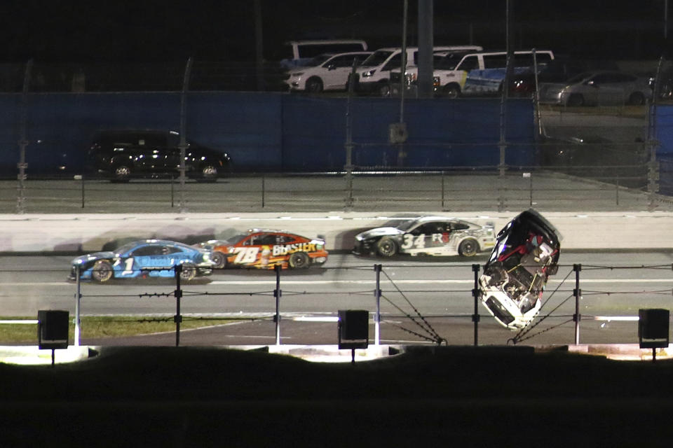 The car of Ryan Preece goes airborne along the back stretch during the NASCAR Cup Series auto race at Daytona International Speedway, Saturday, Aug. 26, 2023, in Daytona Beach, Fla. (AP Photo/Jim Topper)