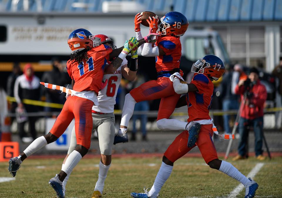 Millville's Ti-yon Cephas (16) makes a catch during Thursday's game against Vineland. The Thunderbolts topped the Fighting Clan 47-0 at Wheaton Field on Thursday, Nov. 25, 2021.