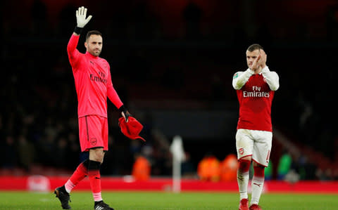 David Ospina and Jack Wilshere salute the crowd - Credit: Reuters