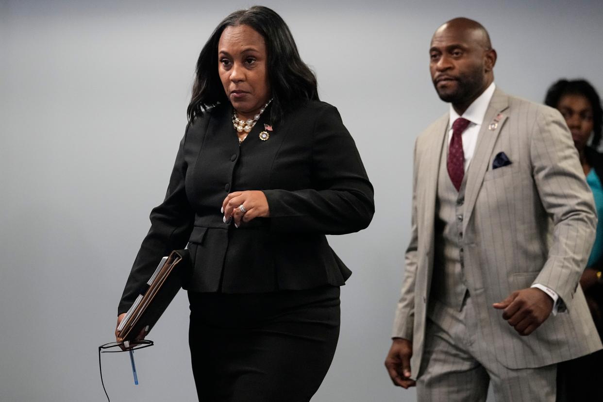 Fulton County District Attorney Fani Willis, followed by special prosecutor Nathan Wade, arrives for a news conference on Aug. 14, 2023, in Atlanta. They're prosecuting an election fraud case against former President Donald Trump and more than a dozen co-defendants.