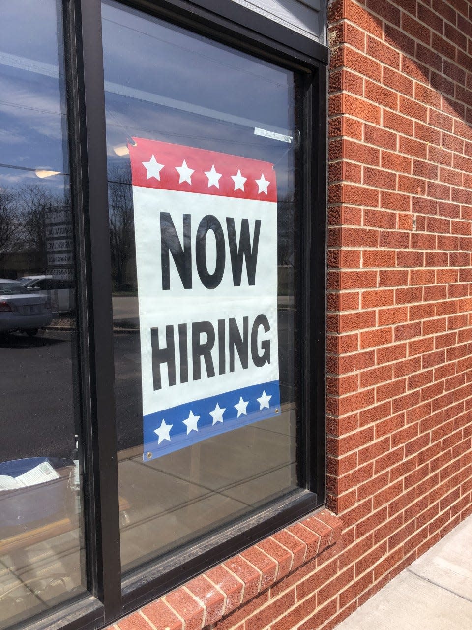 Life Patterns Inc., 3300 S.W. 29th St., Suite 100, displays a "now hiring" sign prominently in its window.