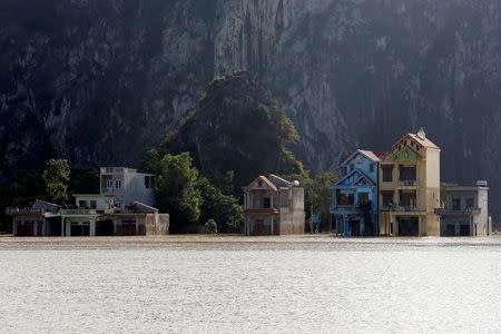 Submerged houses are seen at a flooded village after a heavy rainfall caused by a tropical depression in Ninh Binh province, Vietnam October 14, 2017. REUTERS/Kham