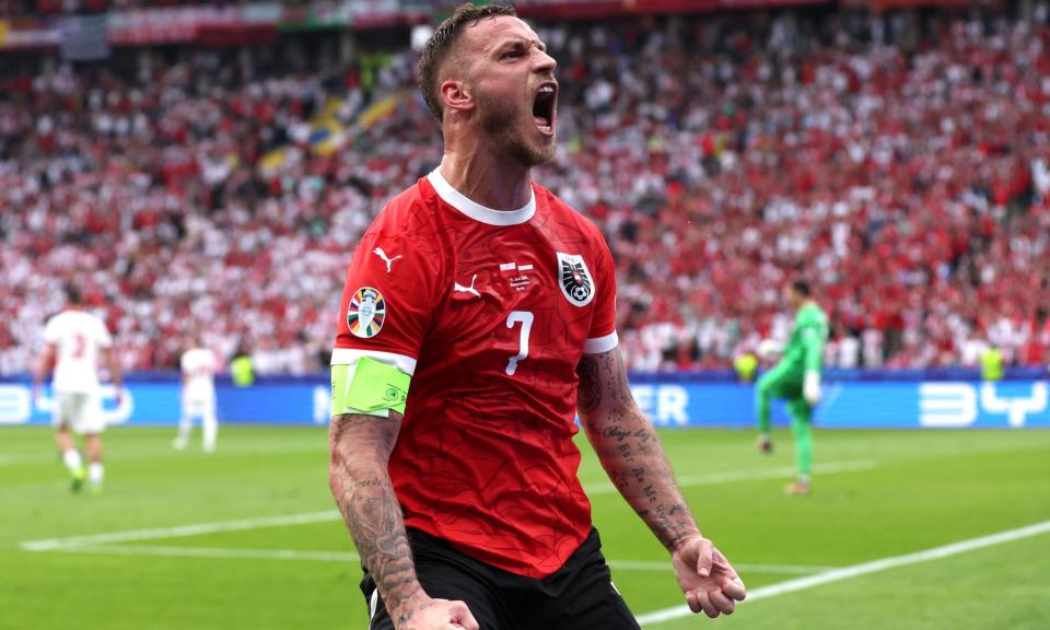 <span>Marko Arnautovic celebrates scoring Austria's third goal from a penalty.</span><span>Photograph: Alex Livesey/Getty Images</span>