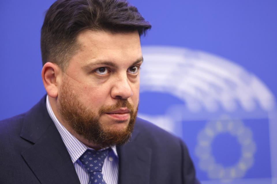 FILE - Leonid Volkov, chief of staff for the late Russian opposition leader Alexei Navalny watches a session of the European Parliament in Strasbourg, France, on Dec. 15, 2021. Volkov had his arm broken by an attacker wielding a hammer in Vilnius, Lithuania, in March. Lithuania's security service said the assault was probably "Russian-organized and implemented." (AP Photo/Jean-Francois Badias, File)