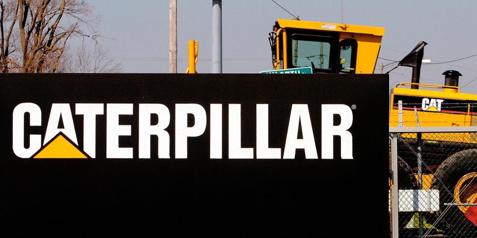 n this April 20, 2007 file photo, a Caterpillar grader is trucked out of the plant in Decatur, Ill. Caterpillar Inc. said Friday, April 5, 2013, it plans to lay off more than 460 employees this June at its Decatur plant as part of an ongoing series of production cuts. (AP Photo/Seth Perlman,. File)