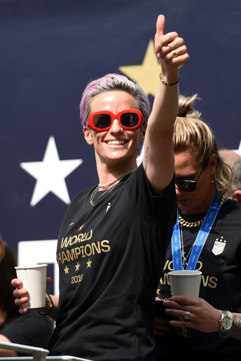 Megan Rapinoe gives a thumbs up as the U.S. Women's National Soccer Team celebrate their fourth World Cup win with a ticker tape parade down the Canyon of Heroes on Wednesday, July 10, 2019, in New York.