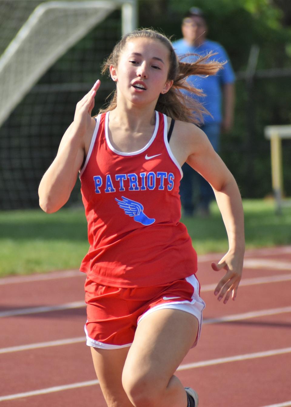 Owen Valley's Olivia Wainscott runs the 100-meter dash Bloomington North sectional on May 17, 2022.