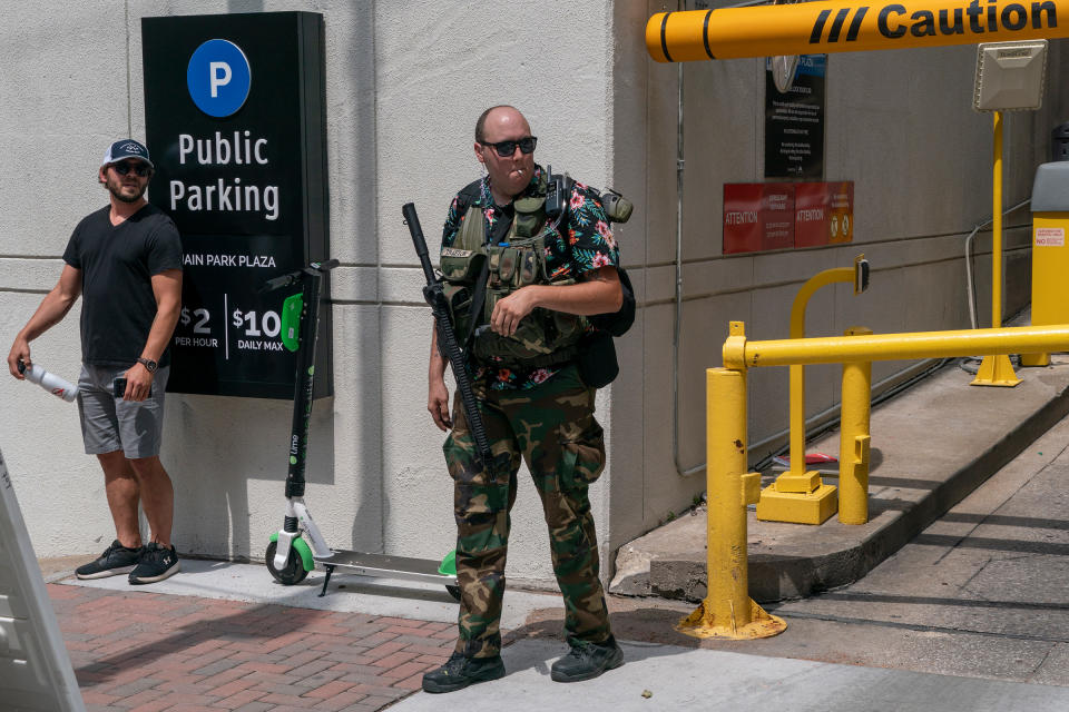 <strong>Tulsa, June 20, 2020.</strong> A Boogaloo Boi carries a rifle outside the BOK Center before Trump's rally.<span class="copyright">Peter van Agtmael—Magnum Photos for TIME</span>