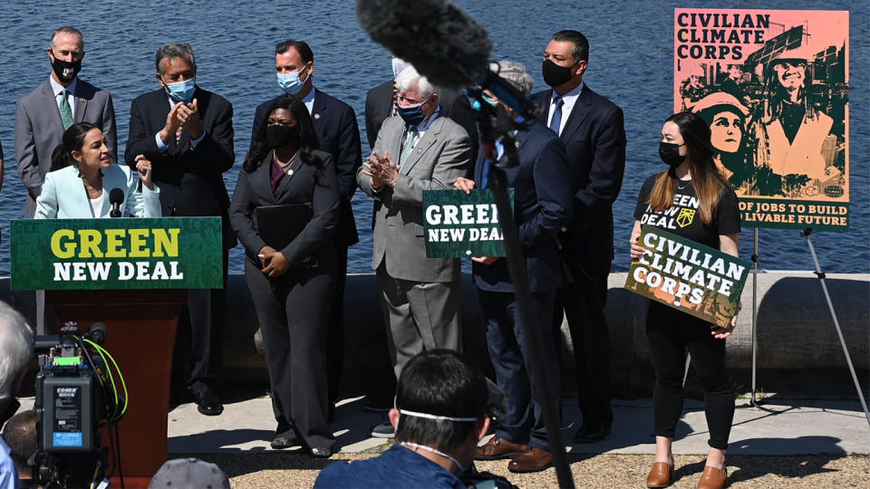 Representative Alexandria Ocasio-Cortez(D-NY) next to Senator Ed Markey, D-MA, speaks during a press conference to re-introduce the Green New Deal in front of the US Capitol in Washington, DC on April 20, 2021. (Mandel Ngan/AFP via Getty Images)