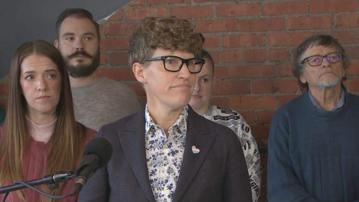 NDP housing critic Janis Irwin stood with Calgary renters while speaking about her proposed bill introduced in the Alberta legislature on Tuesday.  (Mike Symington/CBC - image credit)