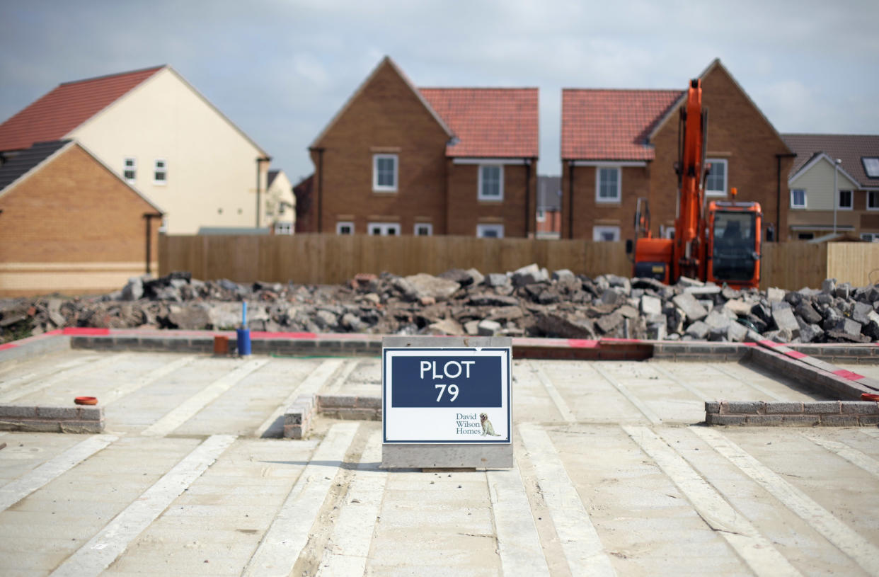 A sign marks the plot for a new home being constructed on a residential housing estate in Somerset, England. 