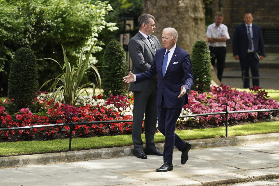 US President Joe Biden walks to be greeted by Britain's Prime Minister Rishi Sunak, on Downing Street, ahead of their meeting, during his visit to the UK, in London, Monday, July 10, 2023. (James Manning/PA via AP)