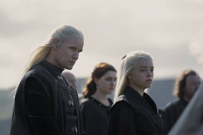 Daemon and Rhaenyra stand side by side looking emotional