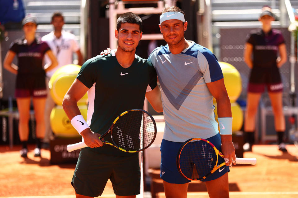 Carlos Alcaraz Garfia of Spain (L) and Rafael Nadal of Spain pose for a photo ahead of their quarter-final match during day nine of Mutua Madrid Open at La Caja Magica on May 06, 2022 in Madrid, Spain. (Clive Brunskill / Getty Images)