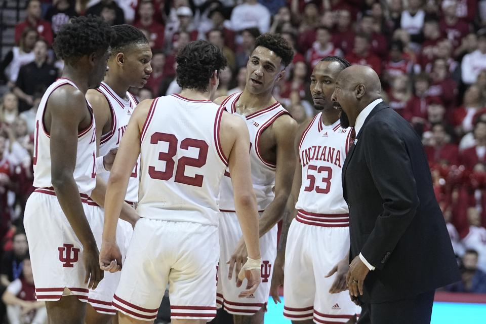 Indiana head coach Mike Woodson talks with his team during the first half of an NCAA college basketball game against Ohio State, Saturday, Jan. 28, 2023, in Bloomington, Ind. (AP Photo/Darron Cummings)