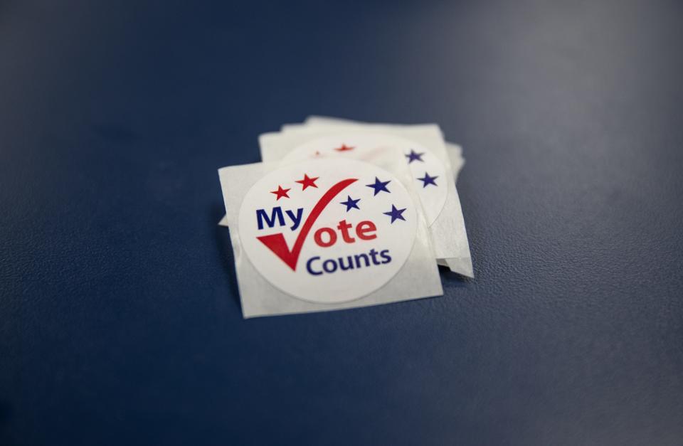 Voting stickers at the Nueces County Courthouse in Corpus Christi, Oct. 20, 2021.