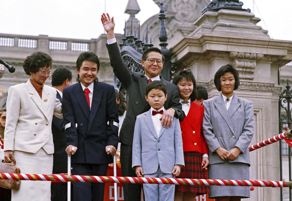 FILE - In this July 8, 1990 file photo, Peru's newly elected President Alberto Fujimori waves to supporters, accompanied by his wife and children, from left, Susana, Hiro Alberto, 13, Kenji Gerardo, 9, Sachie Marcela, 12, and Keiko Sofia, 15, in Lima, Peru. The Fujimori political dynasty began in 1990 when Alberto Fujimori, the Lima-born son of Japanese immigrants, won the presidency promising to usher Peru into a new era of progress. (Alejandro Balaguer/AP Photo, File)