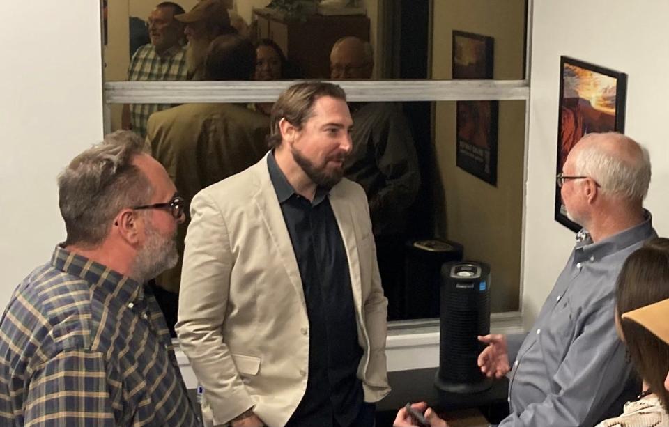 U.S. Rep. Eli Crane, R-Ariz., speaks to members of the board of the Crown King Fire Department on April 13, 2023 at Crane's Prescott field office.