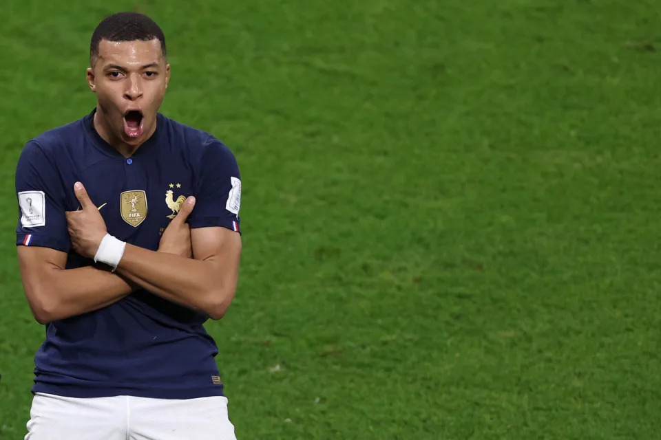 DOHA, QATAR - DECEMBER 04: Kylian Mbappe of France celebrates after scoring the team&#39;s third goal during the FIFA World Cup Qatar 2022 Round of 16 match between France and Poland at Al Thumama Stadium on December 04, 2022 in Doha, Qatar. (Photo by Patrick Smith - FIFA/FIFA via Getty Images)