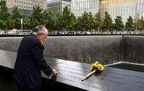 Former New York City Mayor Rudolph Giuliani stands at the edge of the North Pool during memorial observances held at the site of the World Trade Center in New York, September 11, 2014. REUTERS/Justin Lane/Pool