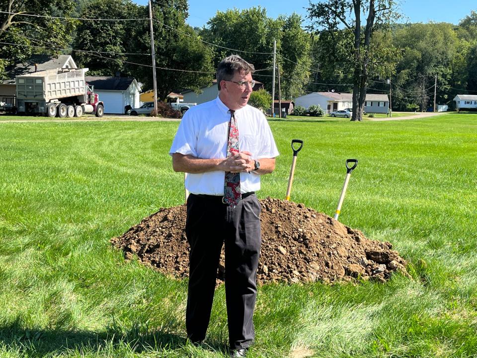 Architect John Picard speaks at a groundbreaking ceremony Tuesday at the site of a new multipurpose building in New Philadelphia that will house the offices of the Tuscarawas County Board of Elections.
