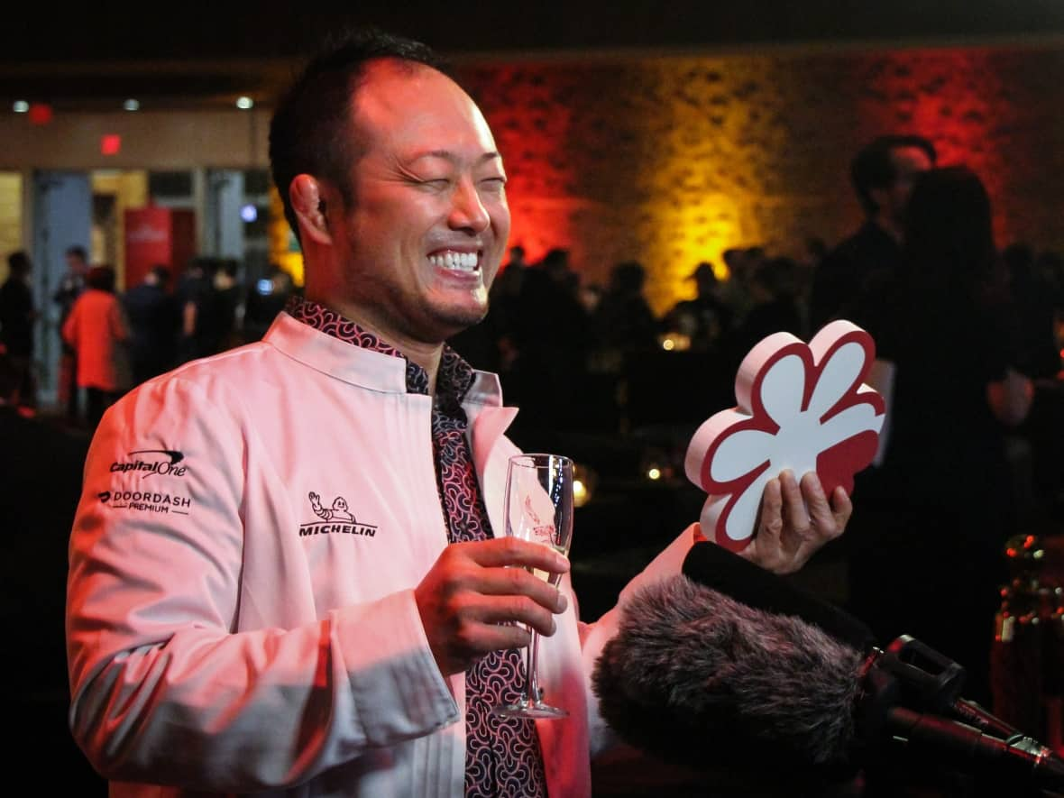 Masayoshi Baba of Masayoshi restaurant on Fraser Street in Vancouver celebrates after being awarded a Michelin star on Thursday, Oct. 28, 2022.  (Arrthy Thayaparan/CBC - image credit)