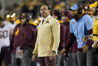 Minnesota head coach P.J. Fleck watches from the sideline during the second half of an NCAA college football game against Iowa, Saturday, Nov. 13, 2021, in Iowa City, Iowa. Iowa won 27-22. (AP Photo/Charlie Neibergall)