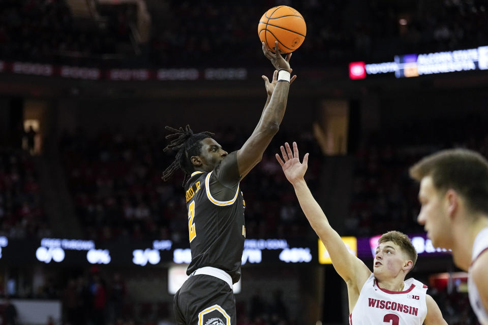 Western Michigan's Tray Maddox (2) shoots against Wisconsin's Connor Essegian, second from left, during the first half of an NCAA college basketball game Friday, Dec. 30, 2022, in Madison, Wis. (AP Photo/Andy Manis)
