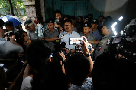 Detained Reuters journalist Wa Lone speaks to the media at a court in Yangon, Myanmar June 18, 2018. REUTERS/Ann Wang