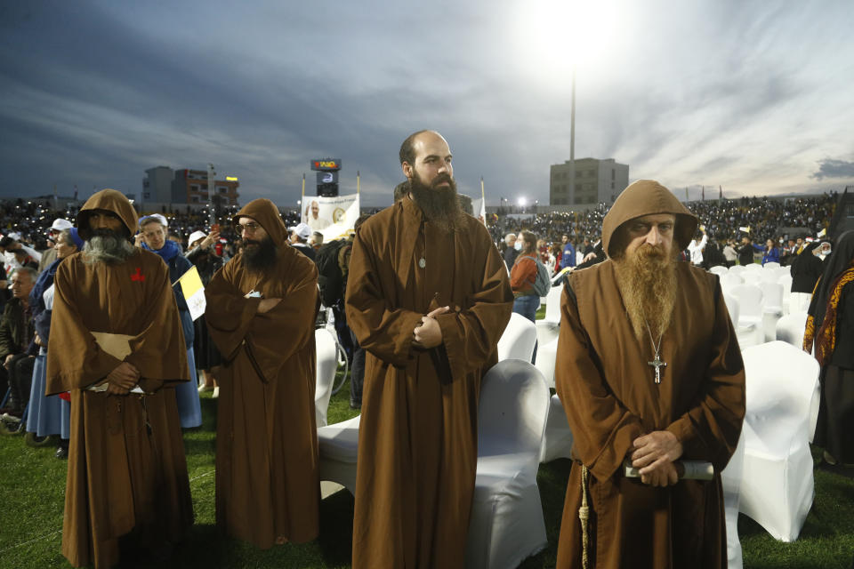 Iraqi Christians say goodbye to Pope Francis after an open air Mass at a stadium in Irbil, Iraq, Sunday, March 7, 2021. (AP Photo/Hadi Mizban)